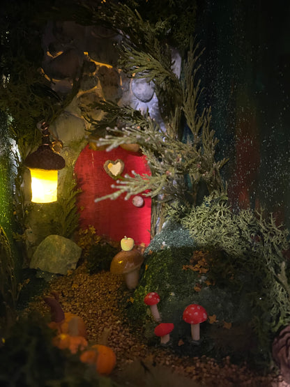 Autumnal forest path book nook with fairy door and lantern